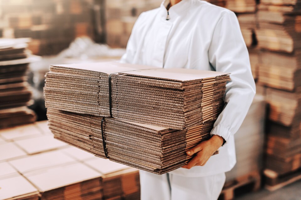 close-up-woman-relocating-boxes-warehouse-large